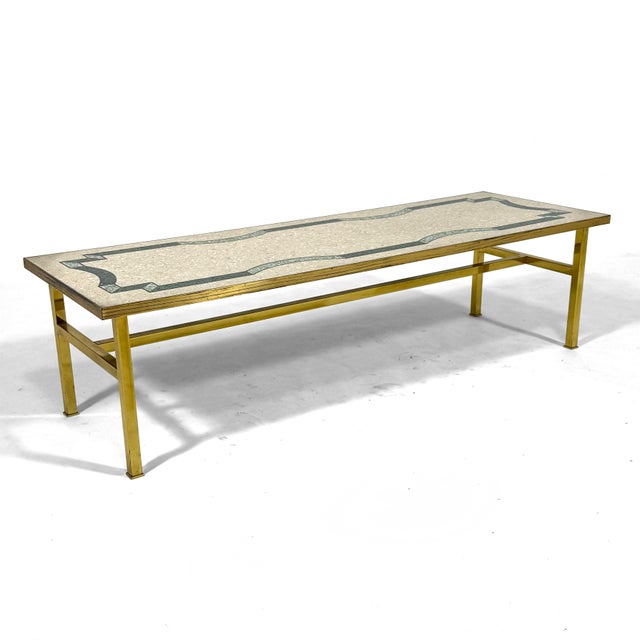 This stunning and incredibly well made coffee table has a substantial brass base which supports a top of terrazzo with a...