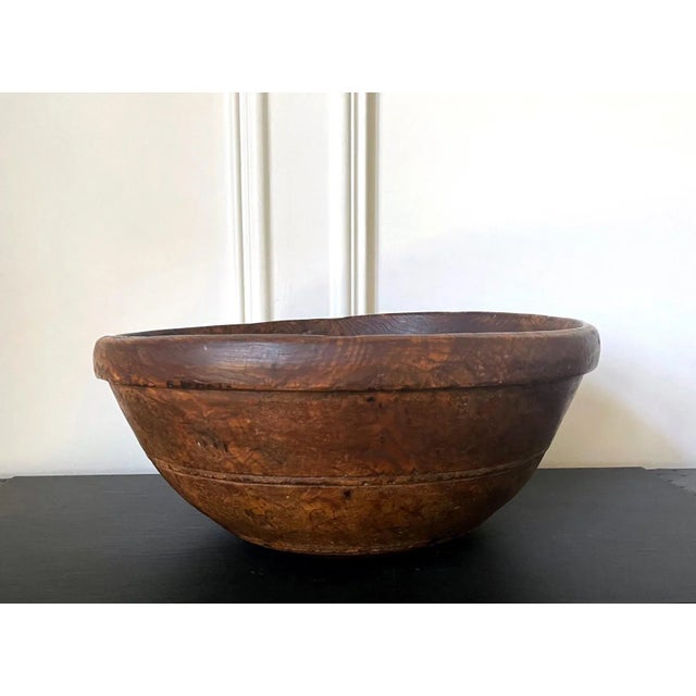 A large American turned wood bowl with impressive burl grains and original surface circa early to mid-19th century, likely...
