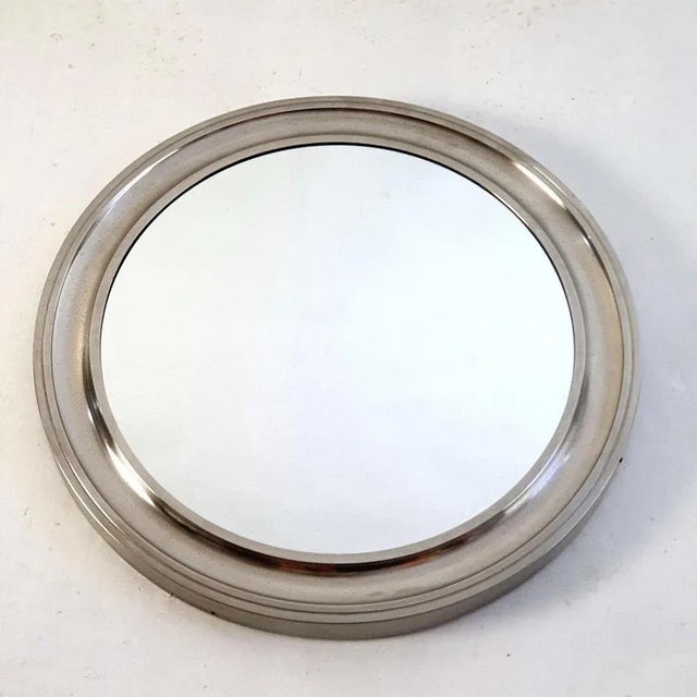 Mid-Century large round wall mirror from the "Narciso" serie by Sergio Mazza for Artemide, 1960s. The material in the...