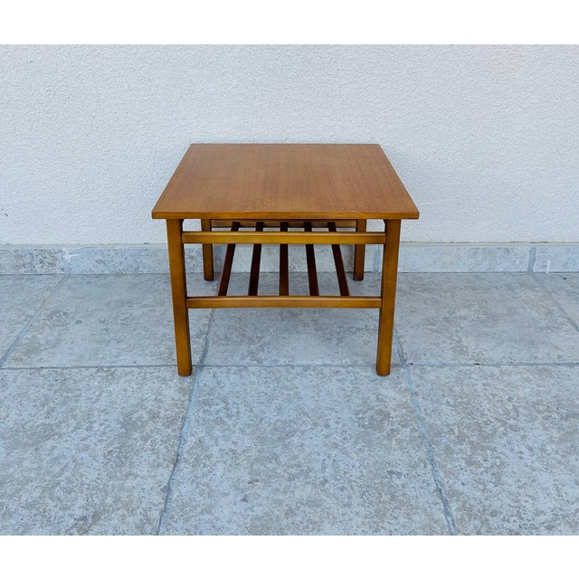 Beautiful scandinavian teak coffee table dating from the 1960s. a second slatted shelf provides a convenient space for...