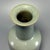 Fine antique Chinese celadon mallet‑form vase. Tall straight cylindrical neck rising upon stout squared body, covered in...