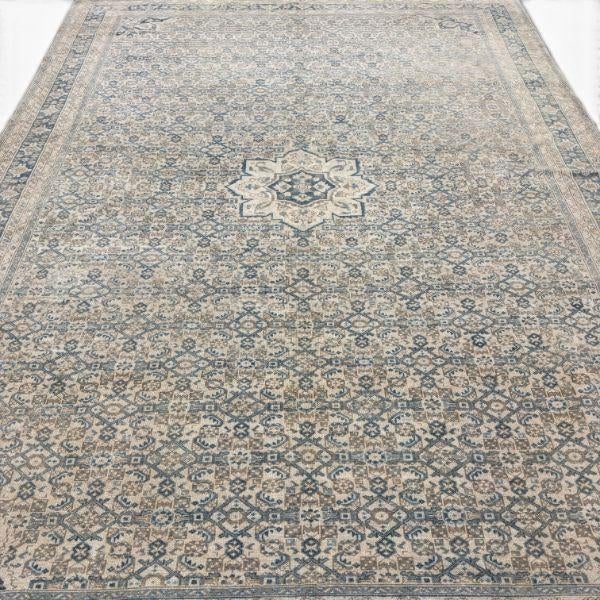 This exceptionally beautiful antique Malayer rug is distinguished by its finely drawn, small-scale floral design and...