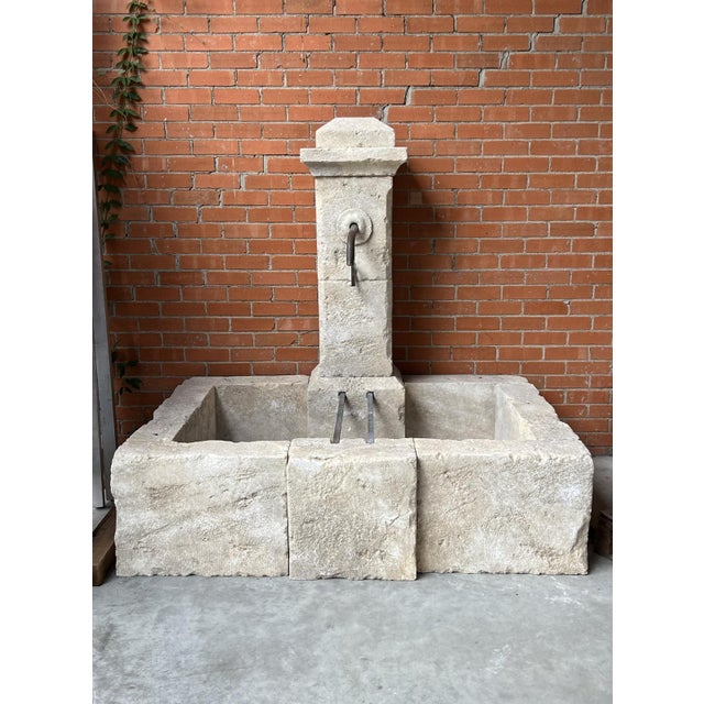 More information coming soon… Hand-carved in the South of France from 12 pieces of limestone, this wall fountain features...