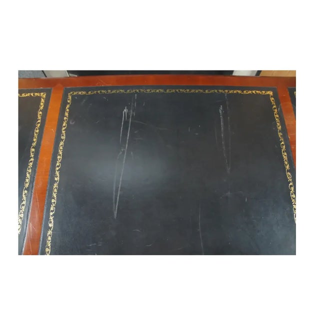 Beautiful and rare mahogany veneer writing desk with three leather gold embossed panel surface, and 3 drawers with...
