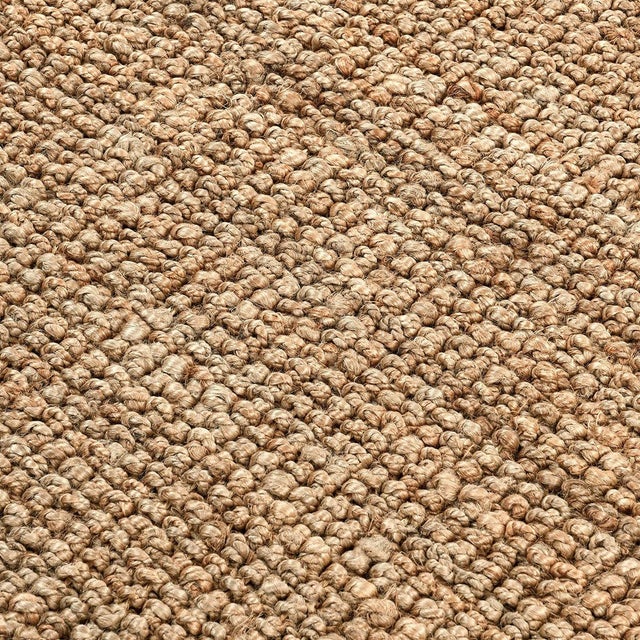 Boucle style weave 100% jute rug in a soft neutral oat color. Available in numerous sizes. Please note that its appearance...
