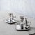 Pair of Old Sheffield plate chambersticks with removable nozzles, conical snuffers, and handled drip pans, circa 1820....