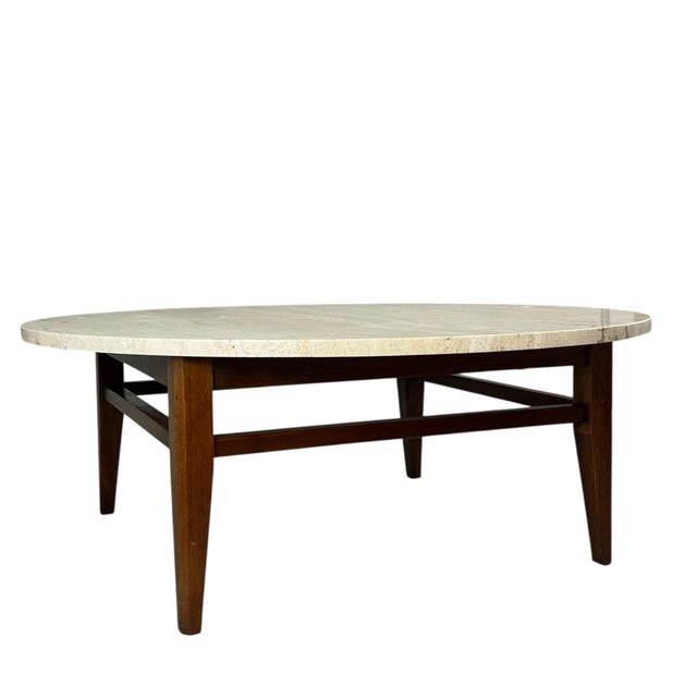Available for sale is this exceptionally crafted vintage coffee table. It features a beautiful travertine top made in...
