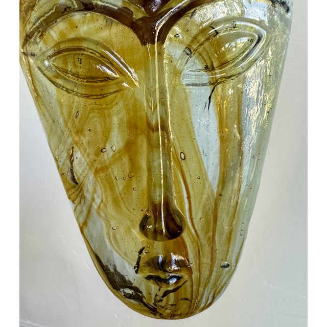Vintage circa 1960s hand-forged glass face mask sculpture. Perfect to lay flat on a book, coffee table or can be hung...