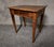 Antique rectangular writing table, likely from the 18th century, crafted primarily from solid walnut. It features a drawer...
