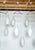 This large 1960s danish pendant light has three beautiful cased white/frosted glass ‘bowling pin’ drops, hung from a...