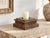 A spike at the center tells you what it was for. This antique teak plinth is built in low, stepped tiers, square at the...