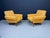 This attractive pair of retro armchairs embodies the clean lines and practical comfort associated with mid-century Central...