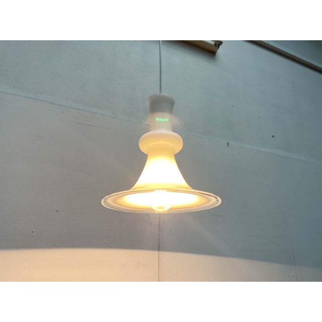 Danish glass pendant lamp by the renowned manufacturer Holmegaard / Royal Copenhagen, designed by Michael Bang in the...