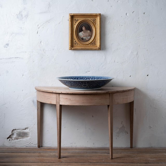 19th Century Continental School, after Guido Reni Cleopatra with the Asp Oil on board, oval, set within a giltwood frame...