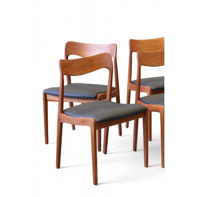 Elegant Danish teak chair designed by Henning Kjærnulf for Korup Stolefabrik with a classic Scandinavian design language....