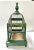 An early 20th-century decorative wire birdcage featuring a domed top and hand-painted green wooden base adorned with...