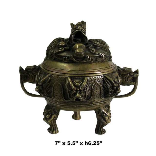 This dark brown color incense burner is made of bronze mix material, It has carved dragon head on its lid, dragon heads...