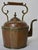 This 19th century copper and brass water pot has detailing like no other. Starting at the bottom with a beautiful brass...