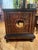 Italian, circa 1900. A fantastic rosewood veneer and ebonized hardwood cabinet. Rectangular form with later dark green...