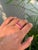 This half band ring features a 1.91 carat pear cut rubies, set in 14K yellow gold. Each measuring approximately 4.52 x...