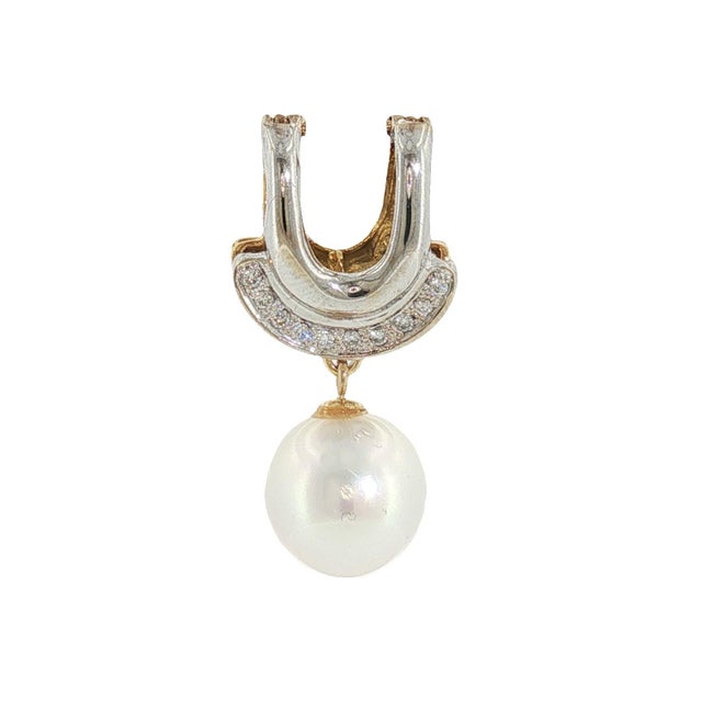 A contemporary two-sided clip pendant featuring a 10.9mm white cultured pearl and diamonds. The top is adorned with...
