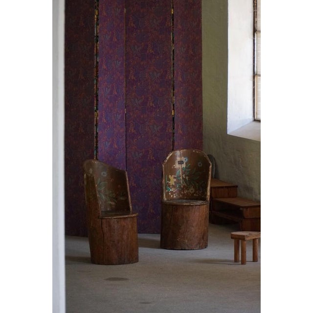 A rare pair of Swedish stump chairs, also known as Kubstol, crafted from solid tree trunks and decorated with charming...