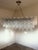 Scenographic italian hand-made chandelier with clear “tronchi”, elements of Murano glass. Huge chandelier in a bath of...