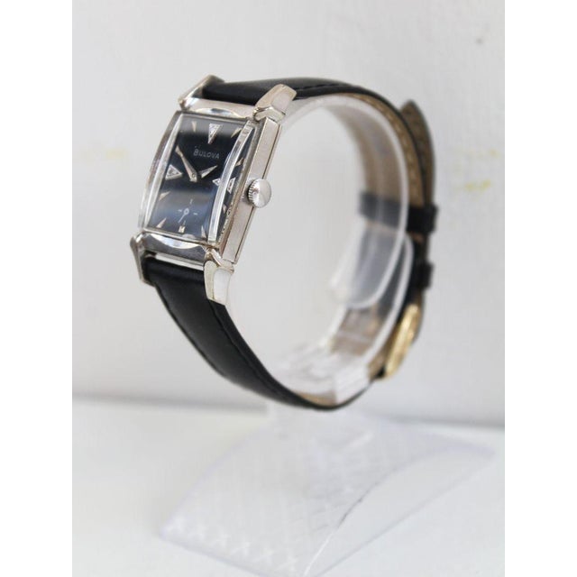 Brand: Bulova Model: Square 8AC Year: 1958 Movement: Manual-winding Materials: Gold-filled Case: 10k gold-filled Dial:...