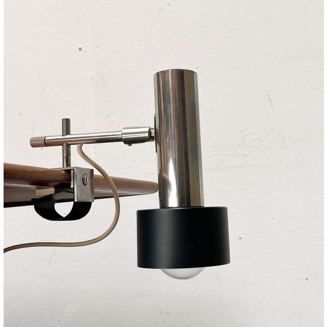 Minimalist clamp lamp by Beisl. The lamp head's striking feature is its minimalist design: simple cylinders of varying...