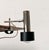 Minimalist clamp lamp by Beisl. The lamp head's striking feature is its minimalist design: simple cylinders of varying...