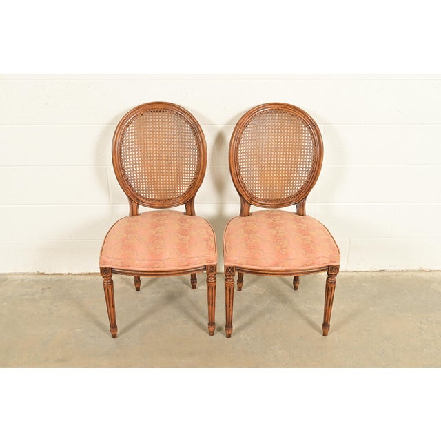 A gorgeous pair of French Regency Louis XVI style side chairs or dining chairs By Karges Furniture USA, Circa 1960s Carved...
