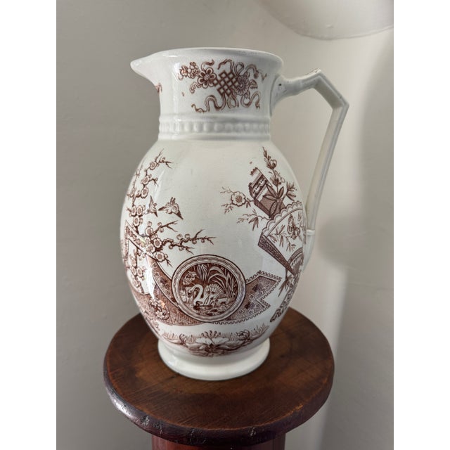 Stunning antique earthenware pitcher dating from the 1880s. Made by W.H. Grindley & Co. in Tunstall, England. Brown...