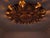This ceiling lamp reflects the sunburst lighting designs popular in mid-century interiors, dated to the 1950s. A dense...