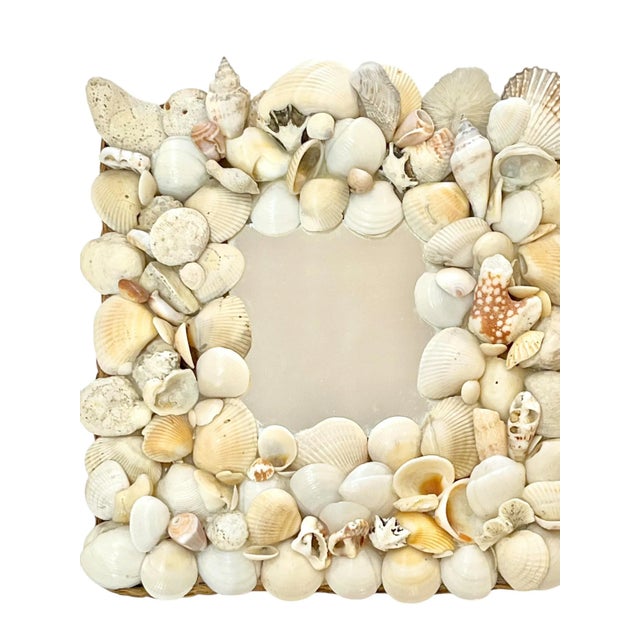 A charming coastal accent, this vintage shell-encrusted mirror captures the essence of seaside décor with its richly...