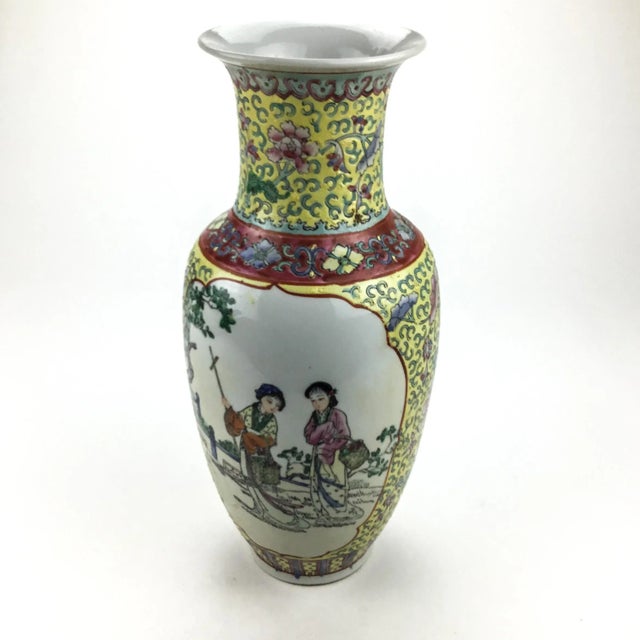 Traditional vase depicting Chinese Ladies walking through the garden. Marked on the bottom. This vase is colorful and it...