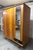 French wardrobe from the 1960s with splayed legs. it consists of a hanging section (2 doors) and a shelving section with 3...