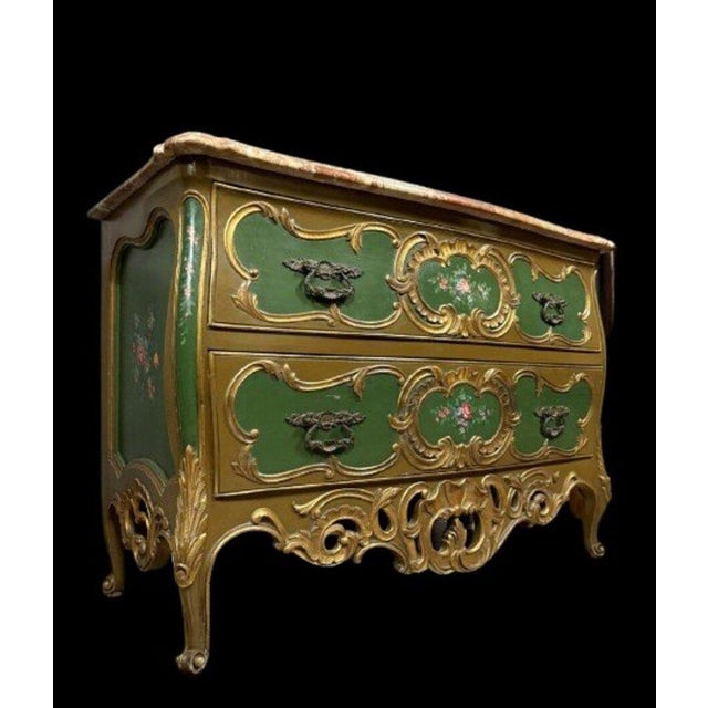 A louis xv style venetian commode with a curved front, crafted from gilt and lacquered wood, circa 1900. The front...