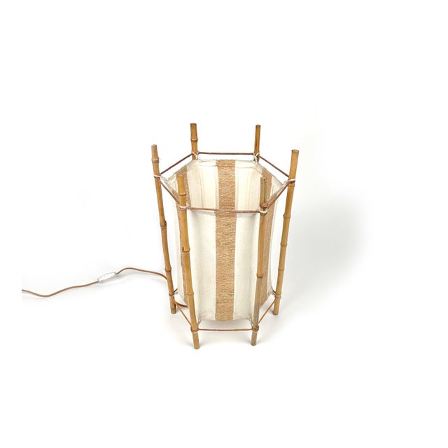 Amazing floor lamp or table lamp in white and brown cotton featuring structure in bamboo composed of six stems in the...