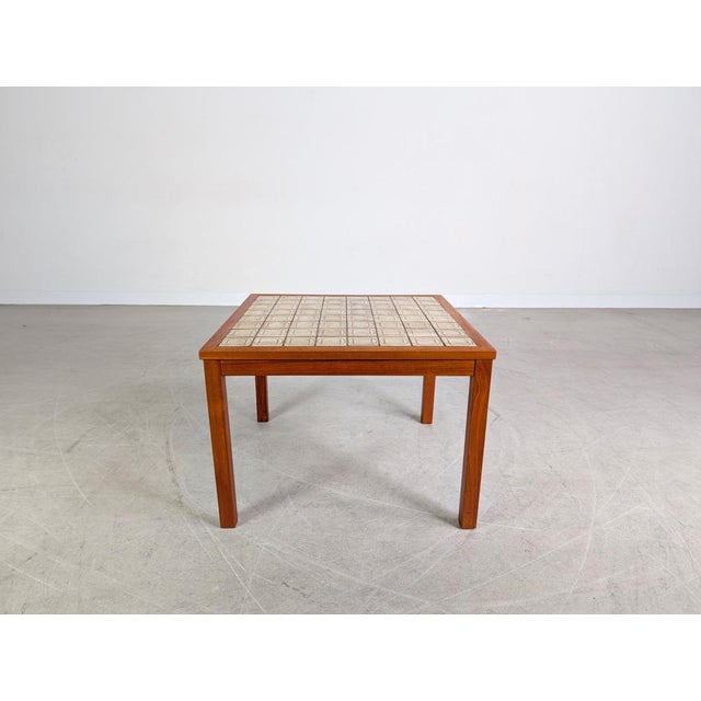 We are offering a beautiful vintage coffee table from the 1970s for sale. The table features a typical Brutalist tiled top...
