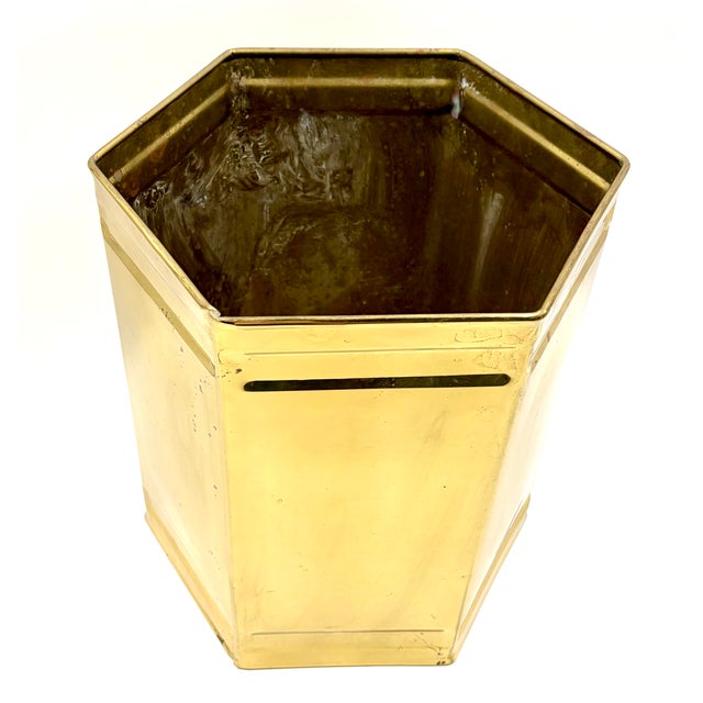 A beautiful Mid-century English brass jardiniere planter. Marked "Made in England" on reverse. This stylish cachepot has a...