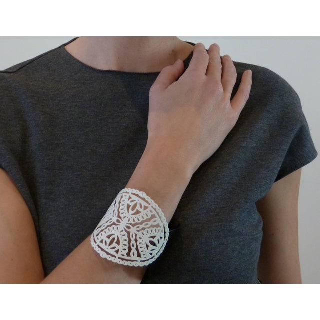 This one-of-a-kind. two-pieced closed cuff is hand-pierced (cut) by the artist from soft brass. Intricate patterns in the...