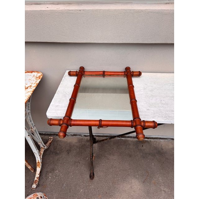French faux bamboo wood mirror, circa 1900. Height / 22.5 inches, Width / 18.5 inches. Mirror / 15.8 by 11.2 inches.