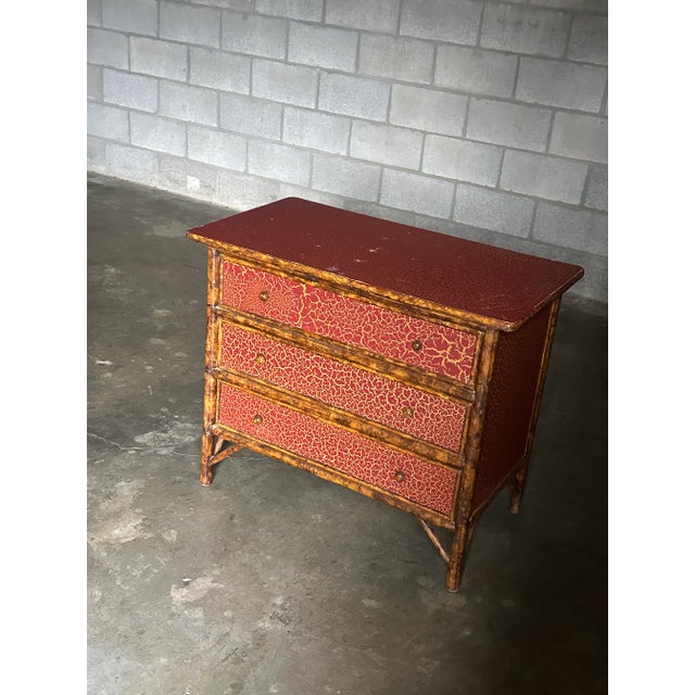 A vintage chest for drawers with frame consisting of faux tortoise shell faux bamboo and the tops and sides with a crackle...