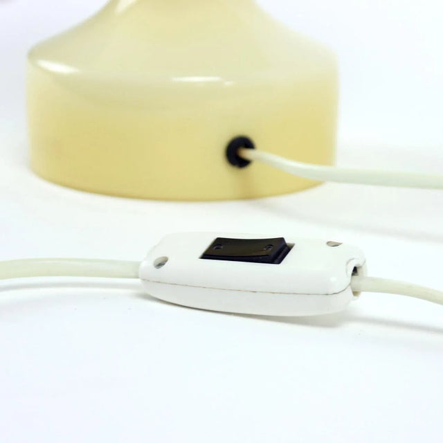 - The top part is matte with white opaline glass - The bottom part is glossy cream-colored opaline glass - Works with one...