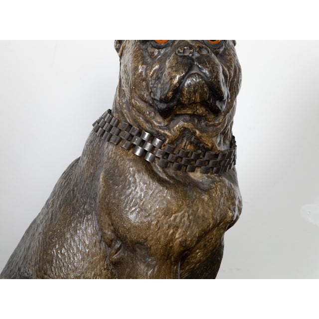 An English terracotta bulldog sculpture from the 19th century, with silver collar and glass eyes. Created in England...