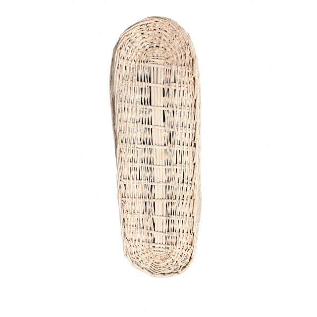 Charming vintage oversized bread basket for long loafs crafted of woven wicker and finished in a soft antique white...