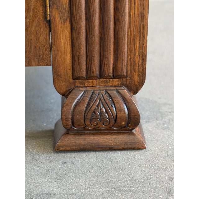 W48 D18 H60.5 Without mirror H36. Mirror W45.5 H25.5 Art Deco oak cabinet featuring an arched mirror, fluted detailing,...