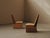 Pair of Art Deco slipper chairs dating from around 1930, with a simple structure and tall, slightly angled backs. The...