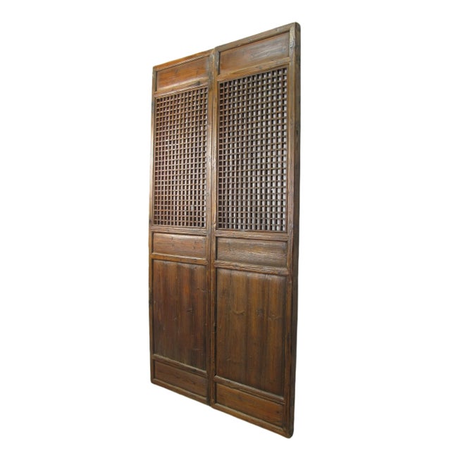 This pair antique Chinese screen door panels showcase hand made small checks lattice patterns. Each lattice panel has over...