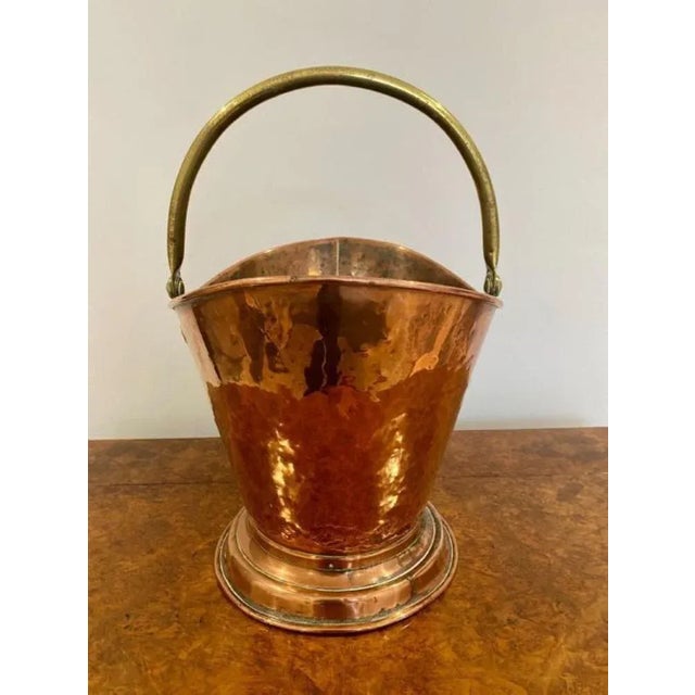 Antique Victorian quality copper and brass helmet coal bucket. Quality copper helmet coal bucket coal bucket raised on a...